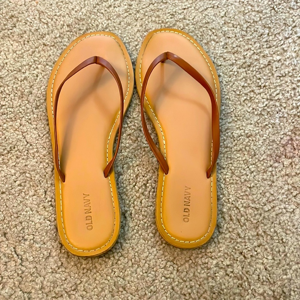Brown flip flops, women’s size 9
